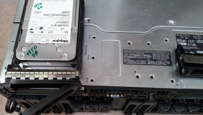 A Maxtor SCSI drive shown on top of a Dell Perc raid rack. There were 3 SCSI disks forming a Raid 5 array and one of them had failed, so the unit was sent to us for recovery of the files.