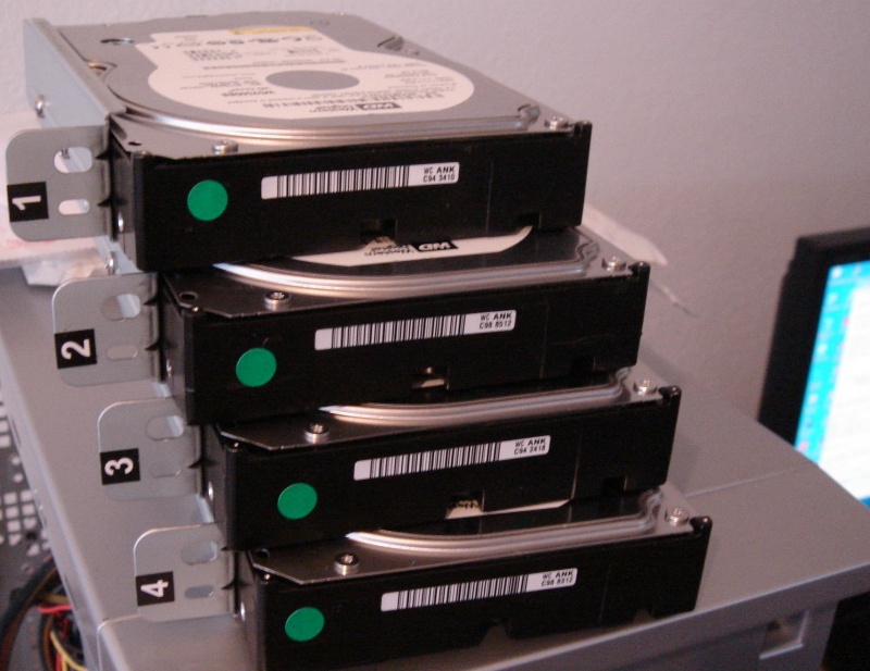 The image shows the 4 hard disk drives taken out of a DriveStation Quattro for data recovery after one disk went faulty and the raid array card configuration was lost.