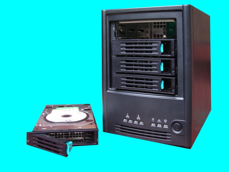 A Intel SS4000-E with the top hard disk removed. This NAS was configured for raid5 but the array failed after a powercut. The hard drives were shown as new instead of being part of an existing array. 