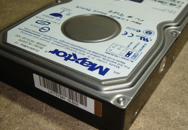 The top corner of a Maxtor hard drive awaiting repair. The client sent it in after it failed to boot up when powered on, and the drive just remained silent. The data was recovered from the disk.