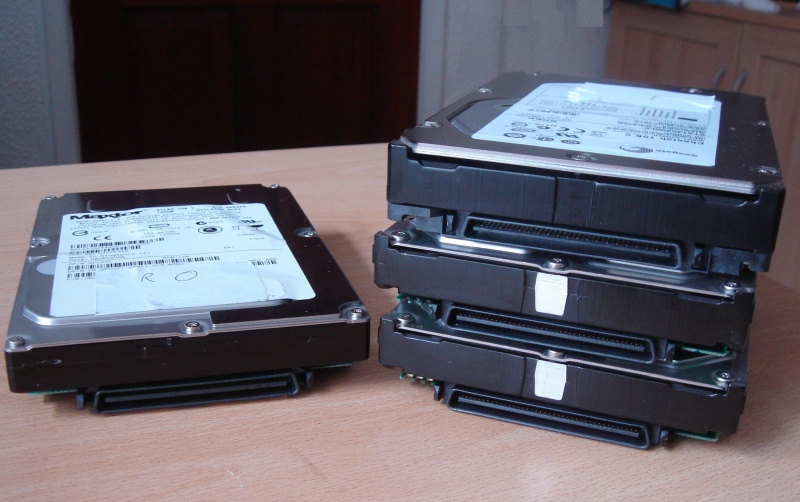 4 SCSI hard drives taken from a Dell PowerEdge 2850 that arrived at our office for recovery following corruption from a faulty raid controller. The Dell PERC had been running in degraded mode for some time before final failure of the hard disks.