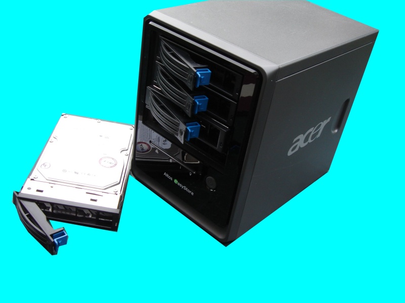 An Acer Altos Easystore is shown with one of the hard disk drives withdrawn from the NAS box. This unit had gone offline from the network overnight following a power cut and had lost the raid configuration for the 4 hdd. 