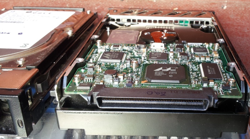 A SCSI hard drive shown with circuit board facing upwards that was one of a 4 disks from a Sagitta SCSI raid server received here for data recovery. The disks were used in a Sagitta EziRAID which is similar to the EziJBOD.