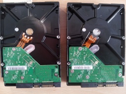 The circuit boards shown from two WD hard drives in for data recovery and repair.