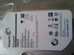 A close up photo of a Seagate ST1000DM003 received by ourselves for recovery of important files. The image shows the label of the drive with capacity 1000GB. 