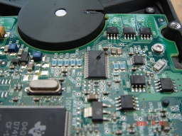 The circuit board is shown being repaired from a Maxtor external hdd which had the wrong power supply put into it and there was no response from the disk.