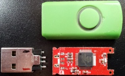 USB stick with fractured connector. The USB drive had 3 of 4 contacts which had fractured off the circuit board. Green Swivel design with single epoxy enclosed memory chip and Alcor AU6989SNHL-G-8 controller chip.