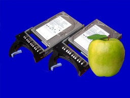 Some raid hard disks from Mac OSX X Server pictured with an Apple. 